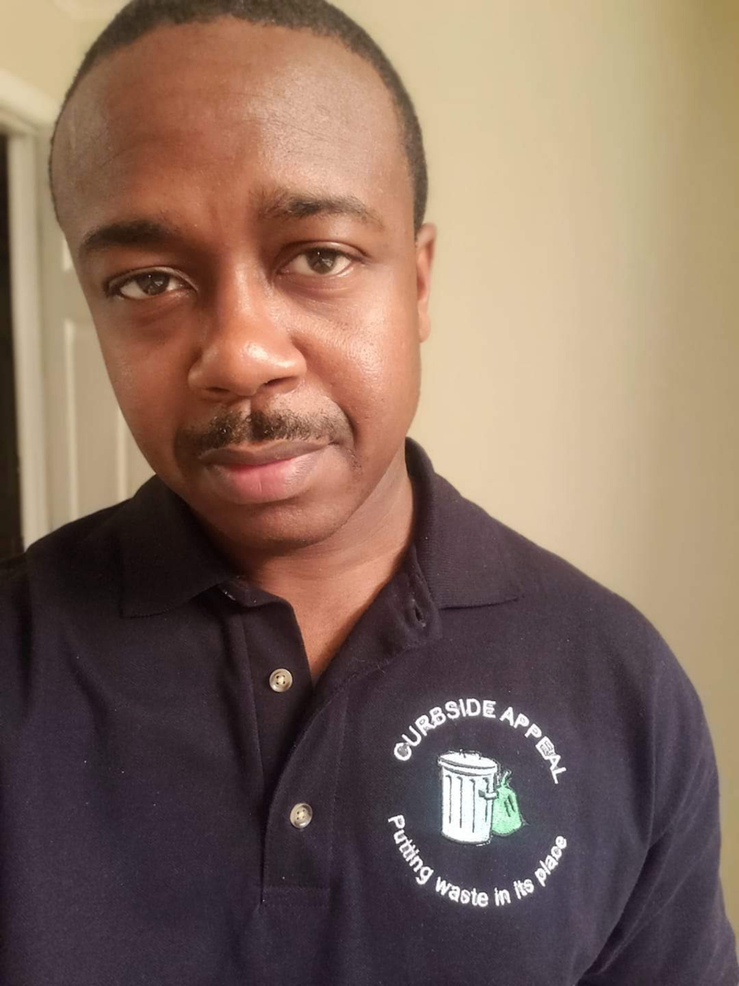 David Baxter, owner of Curbside Appeal, in branded company polo